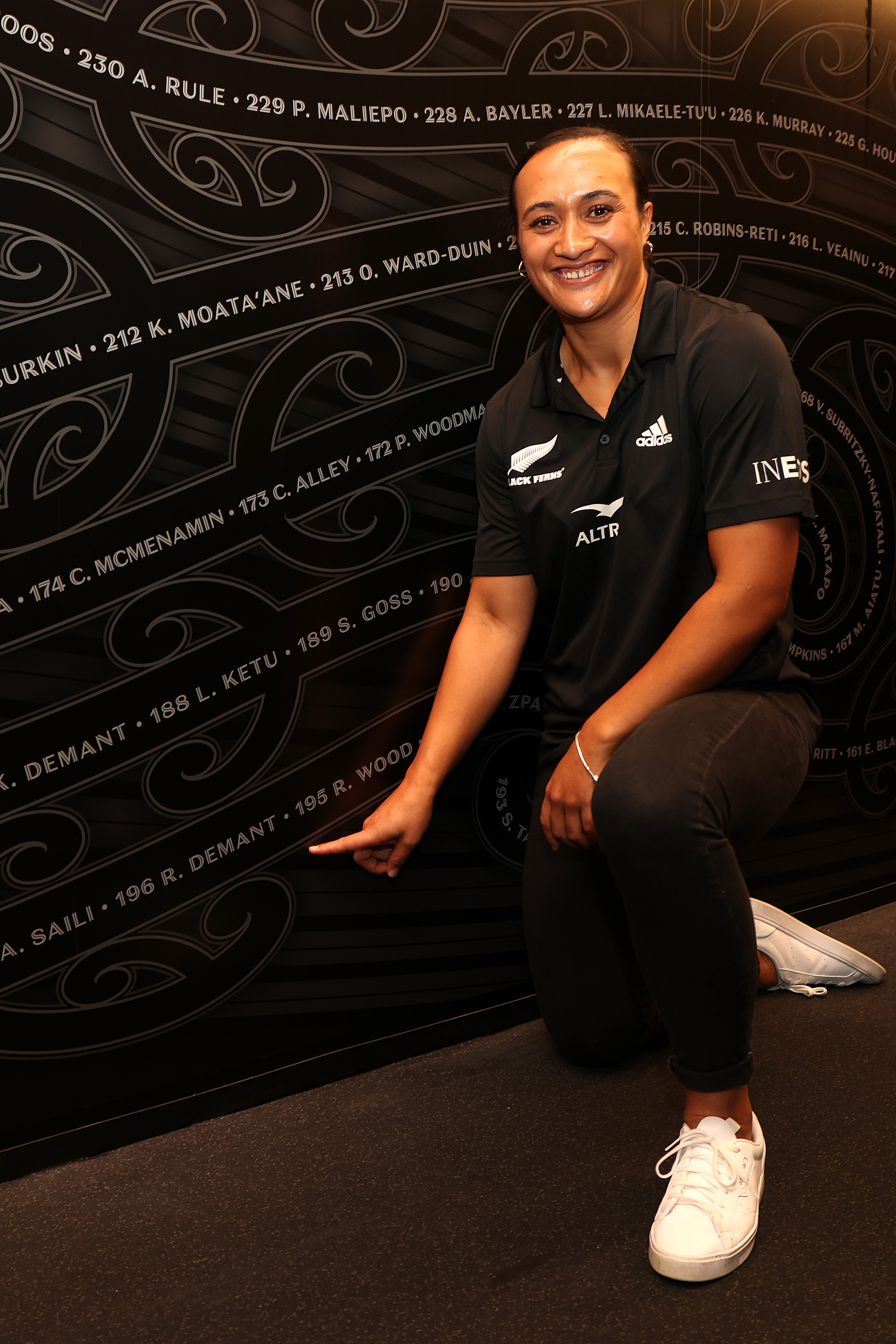 Black Fern Ruahei Demant points to her name on the Black Ferns Awa Manawa during the Black Ferns squad naming for the 2022 June Series at the All Blacks Experience on May 04, 2022