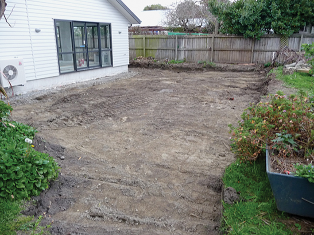 Above: The area on the north side of the house where soil has been remediated and will be used for our new garden area.